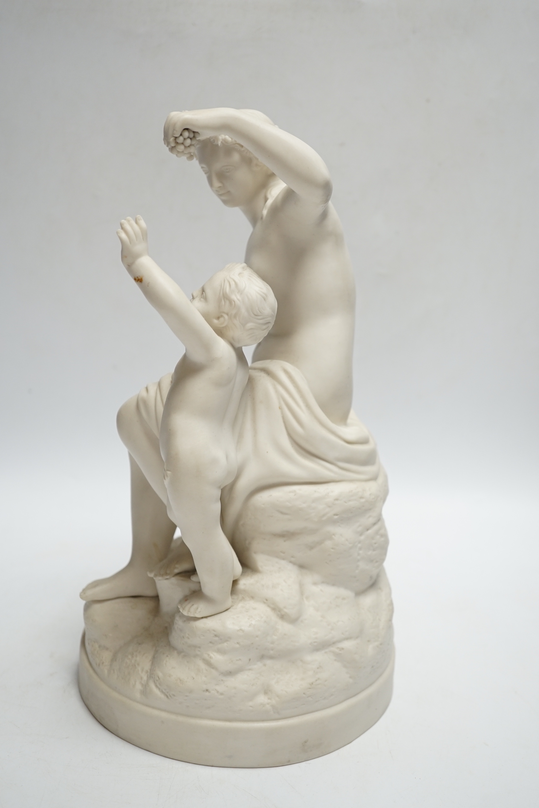A late 19th century parian group of a goddess and putti, 31cm